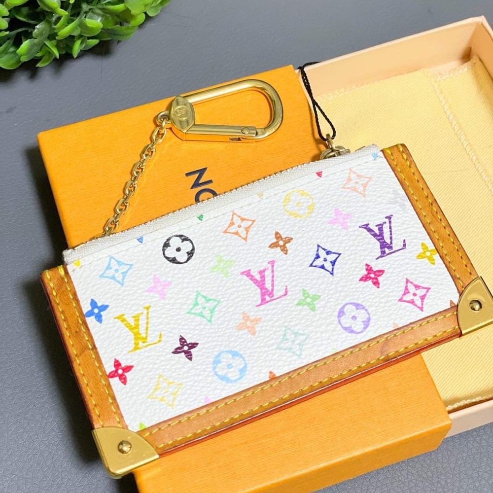 For Sale this Authentic Louis Vuitton Muliticolore keypouch in Blanc!